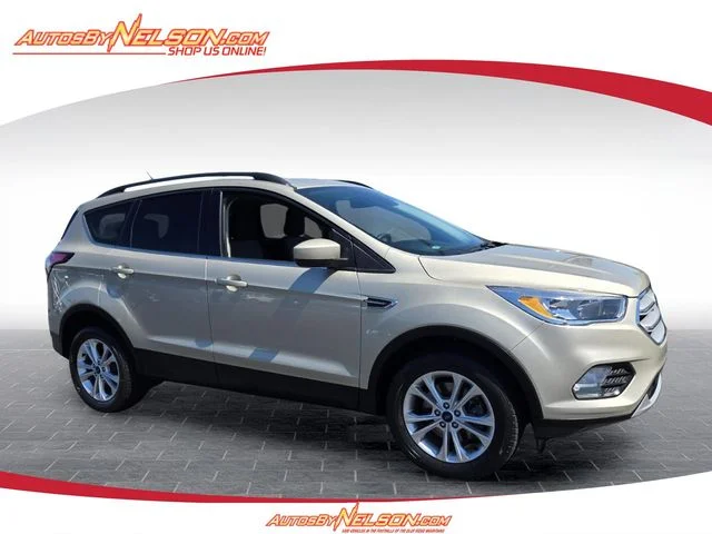 Used 2018 Gold Ford SE image 1