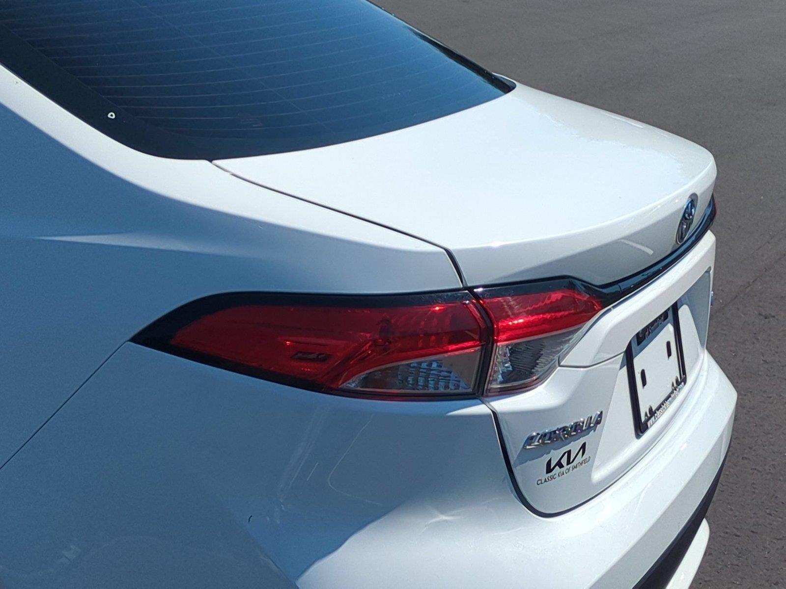 Used 2021 Super White Toyota LE image 12