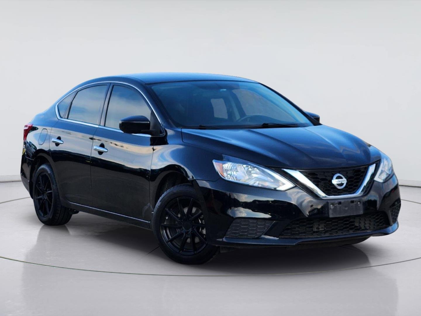 Used 2016 Super Black Nissan SV image 1