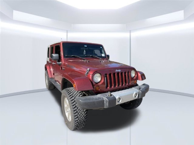 Used 2010 Red Jeep Unlimited Sahara image 3