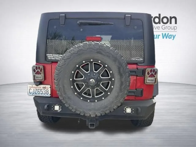 Used 2012 Flame Red Jeep Sport image 10