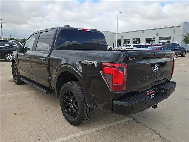 Used 2024 Agate Black Metallic Ford STX 4x4 SuperCrew Cab 5.5 ft. box 145 in. WB image 2