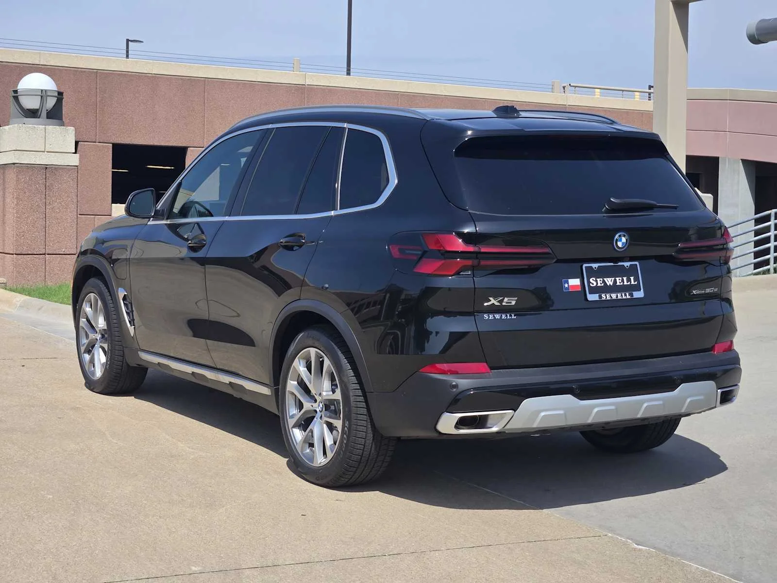 New 2026 Black Sapphire Metallic BMW xDrive50e image 3