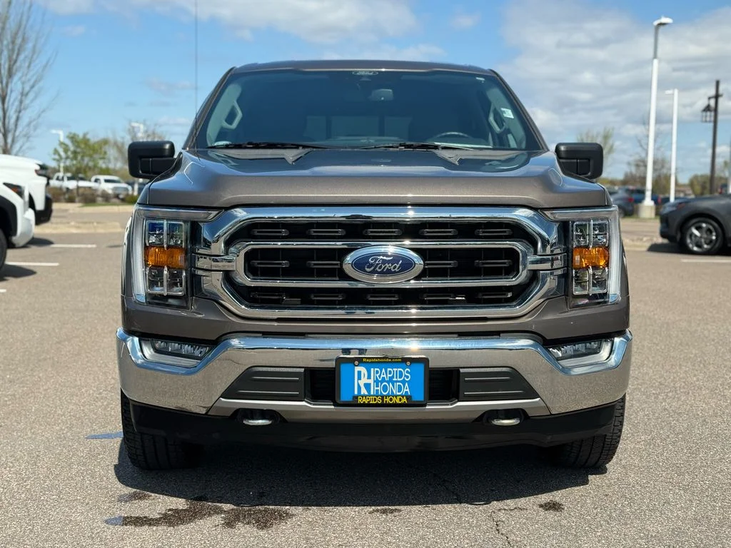 Used 2021 Ford F-150 XLT with VIN 1FTFW1E87MKD82485 for sale in Coon Rapids, Minnesota