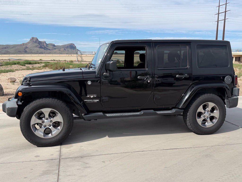 Used 2018 Black Jeep Unlimited Sahara image 5