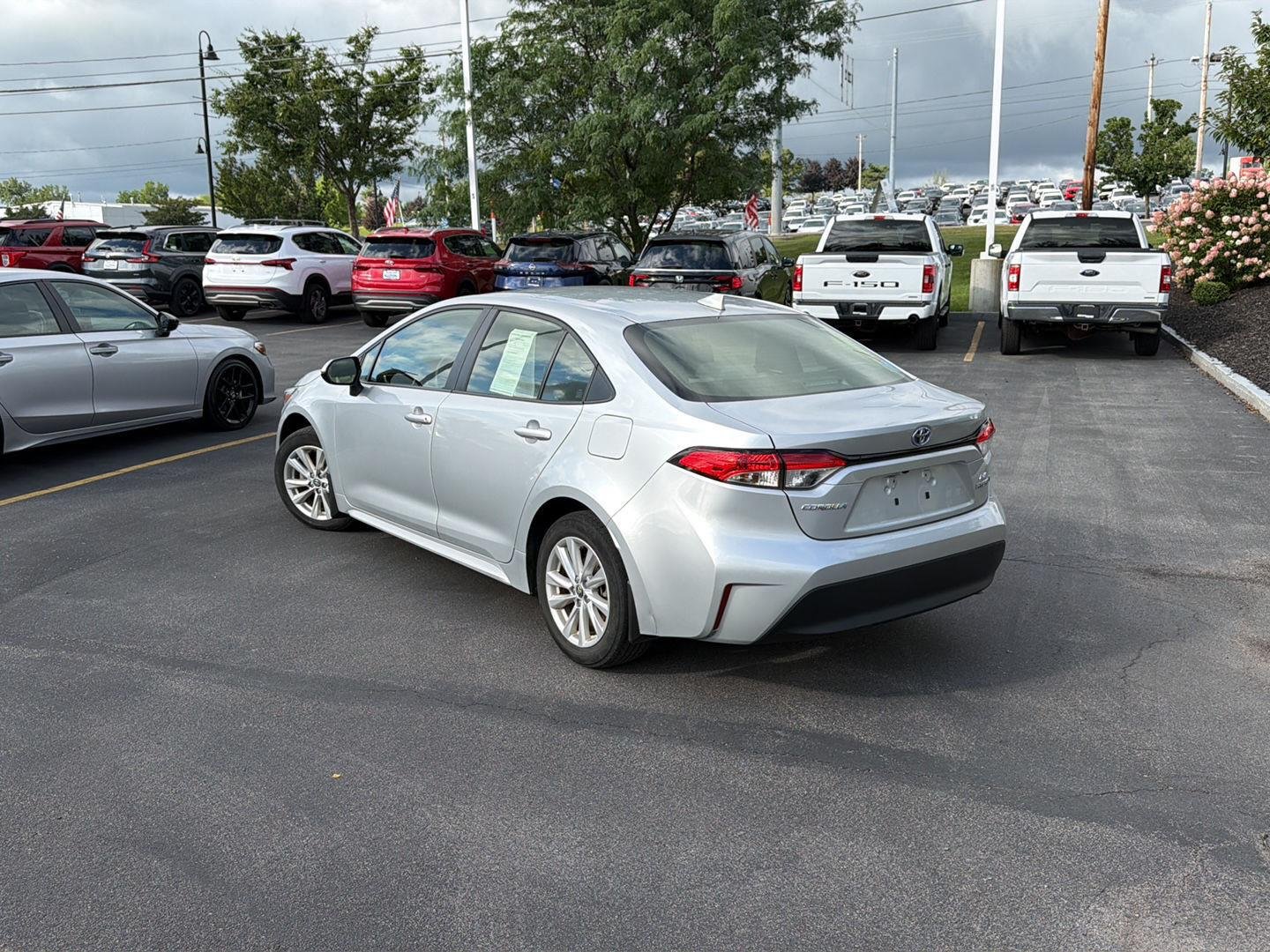 Used 2024 Classic Silver Metallic Toyota Hybrid LE image 5