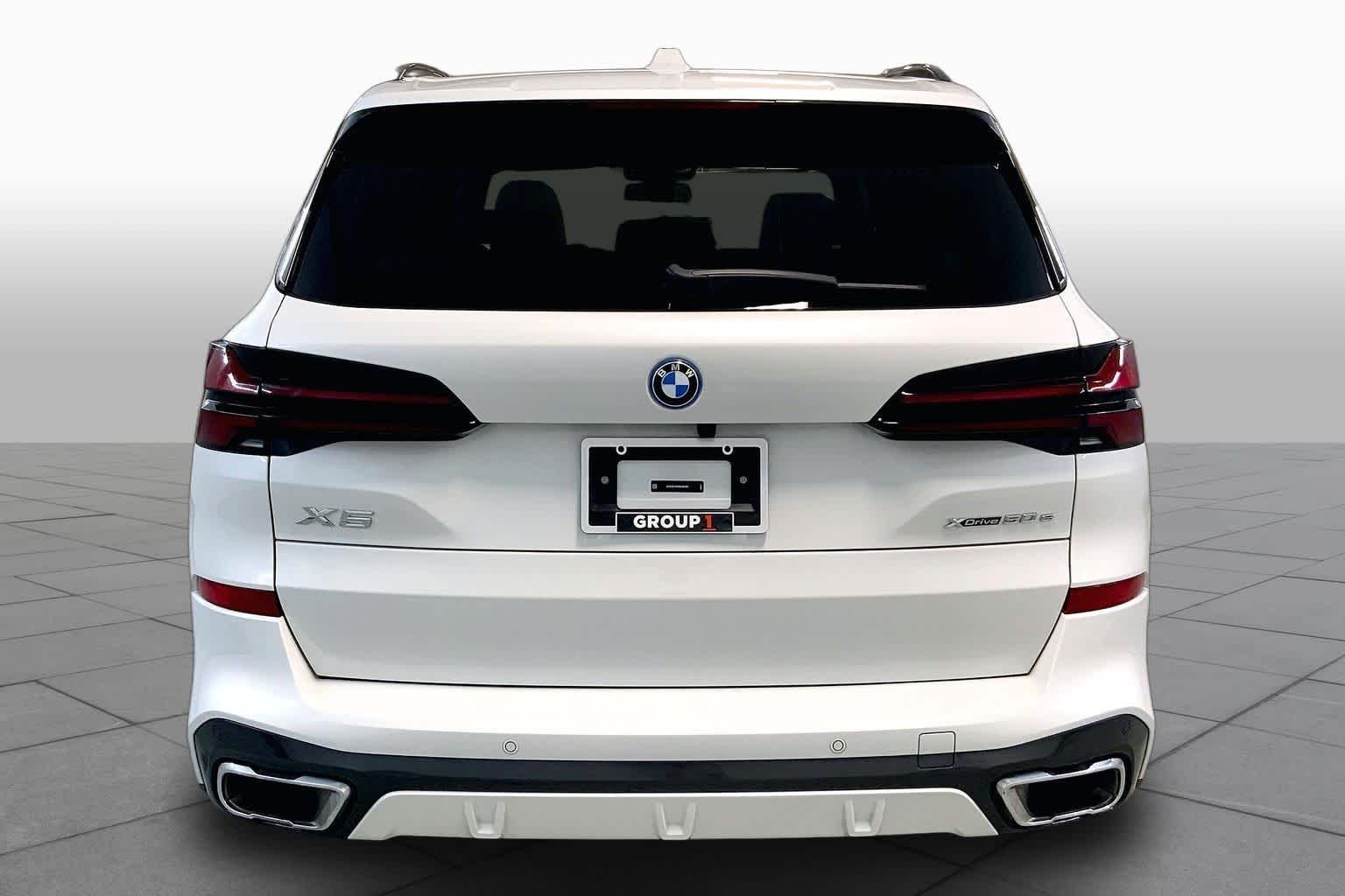 Used 2024 Mineral White Metallic BMW xDrive50e image 4