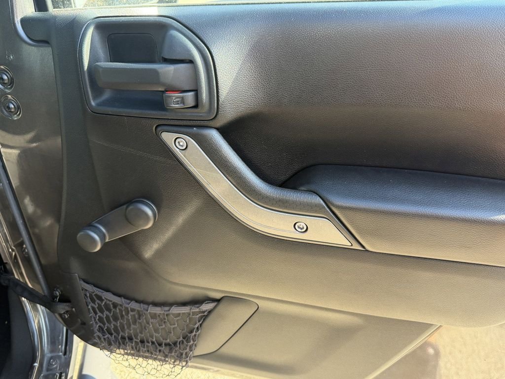 Used 2016 Granite Crystal Clearcoat Metallic Jeep Unlimited Sport image 11