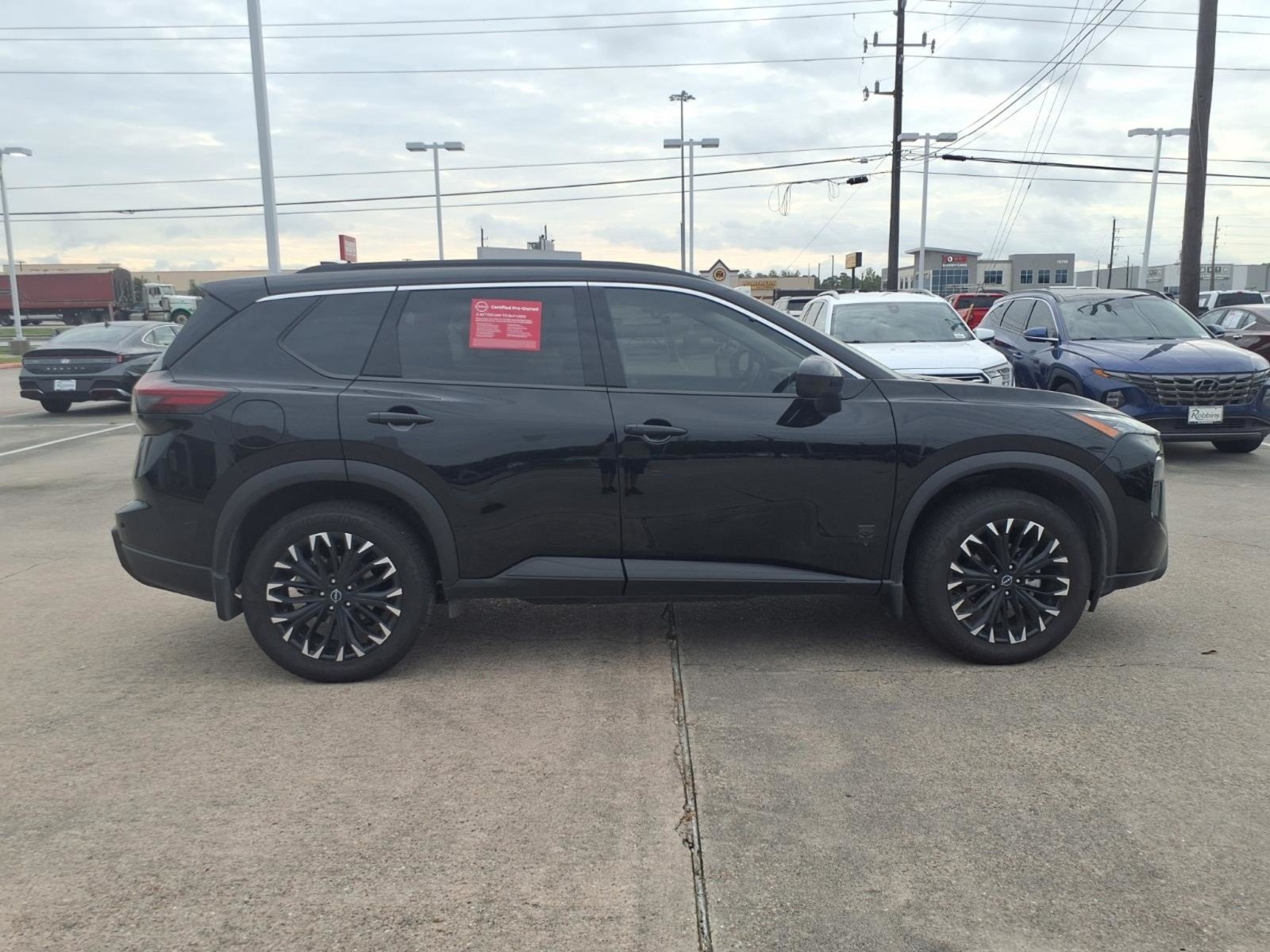 Certified Used 2026 Super Black Nissan Dark Armor image 10