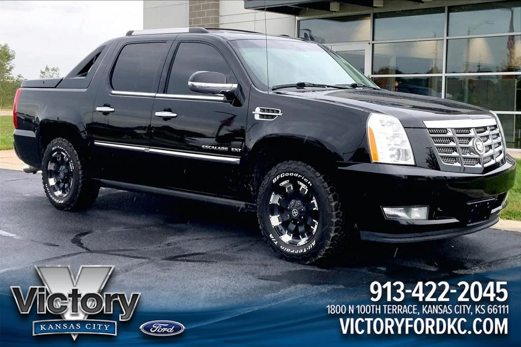 Used 2011 Black Cadillac Premium image 1