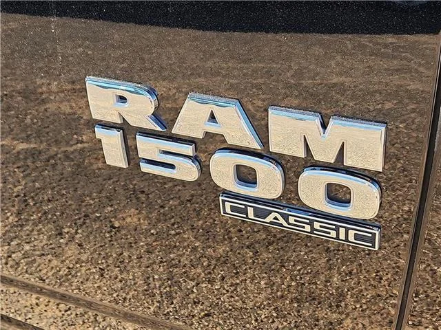 Used 2024 Black Clearcoat RAM SLT 4x4 Quad Cab 6.3 ft. box 140 in. WB image 8