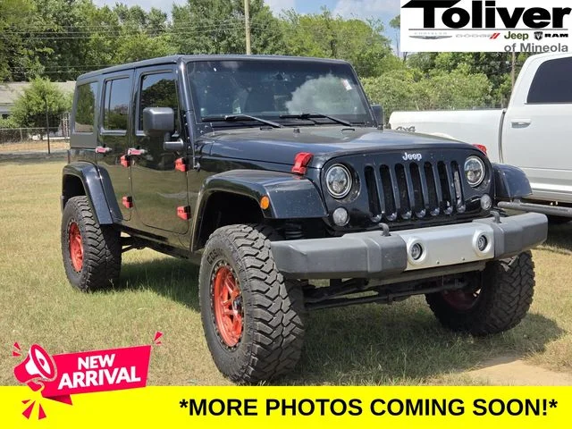 Used 2014 Black Jeep Unlimited Sahara image 1