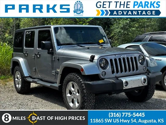 Used 2015 Silver Jeep Unlimited Sahara image 1