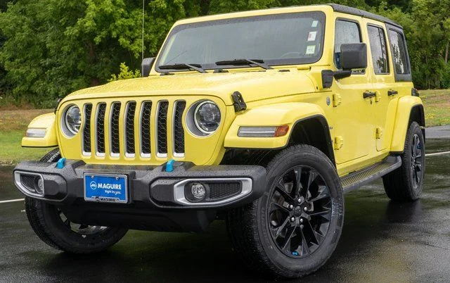 Used 2023 Yellow Jeep Sahara 4xe image 1