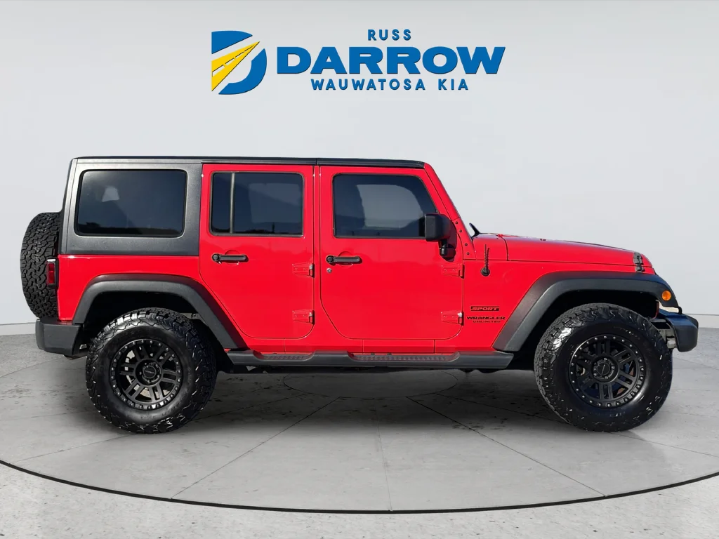 Used 2013 Red Jeep Unlimited Sport image 6
