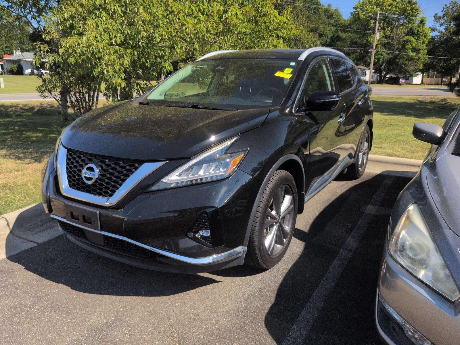 Used 2020 Super Black Metallic Nissan Platinum image 1
