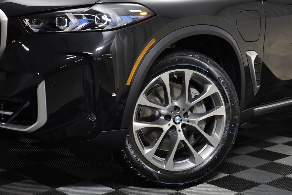 New 2026 Black Sapphire Metallic BMW xDrive50e image 4