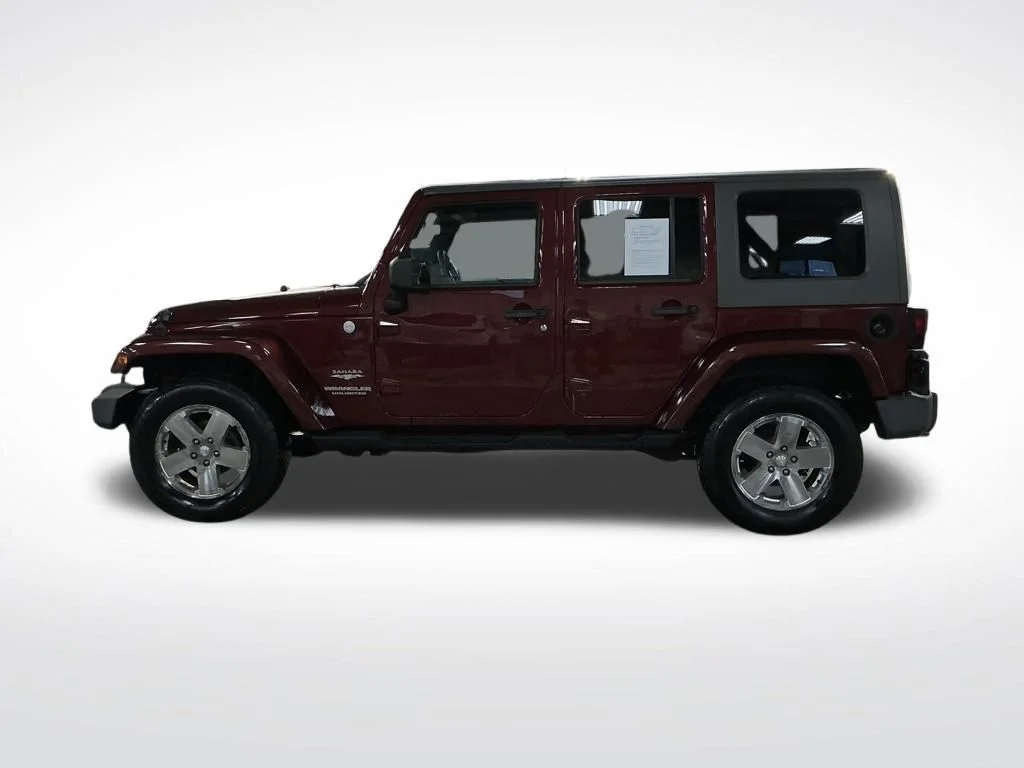 Used 2010 Red Jeep Unlimited Sahara image 2