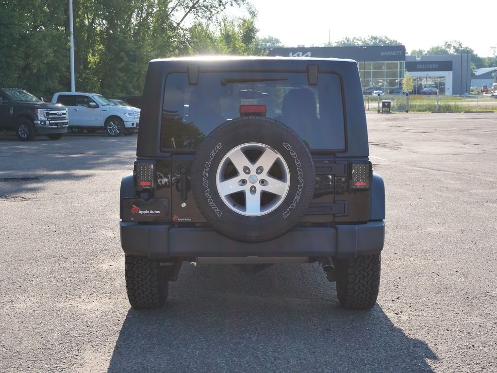 Used 2013 Black Jeep Unlimited Sport image 5