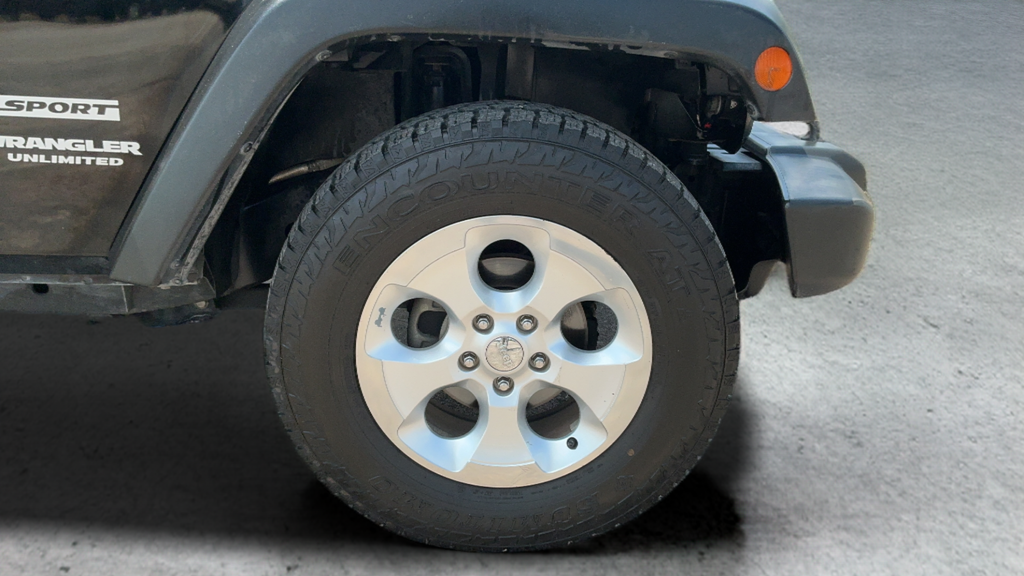 Used 2013 Black Jeep Unlimited Sport image 23