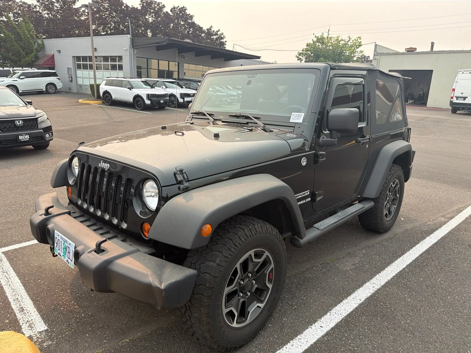 Used 2012 Black Jeep Sport image 1