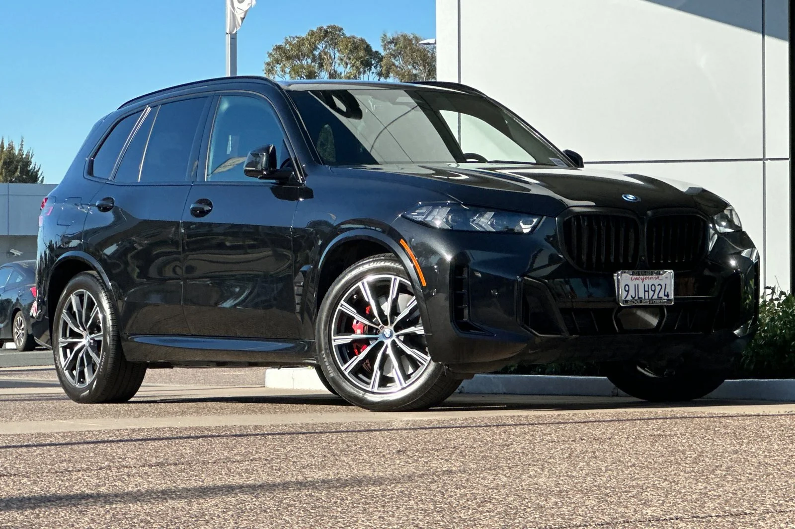 Used 2024 Black Sapphire Metallic BMW xDrive50e image 2
