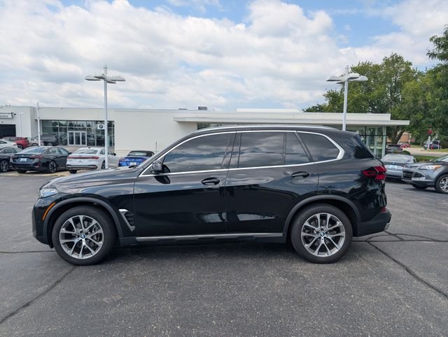 Certified Used 2024 Black Sapphire Metallic BMW xDrive40i image 1