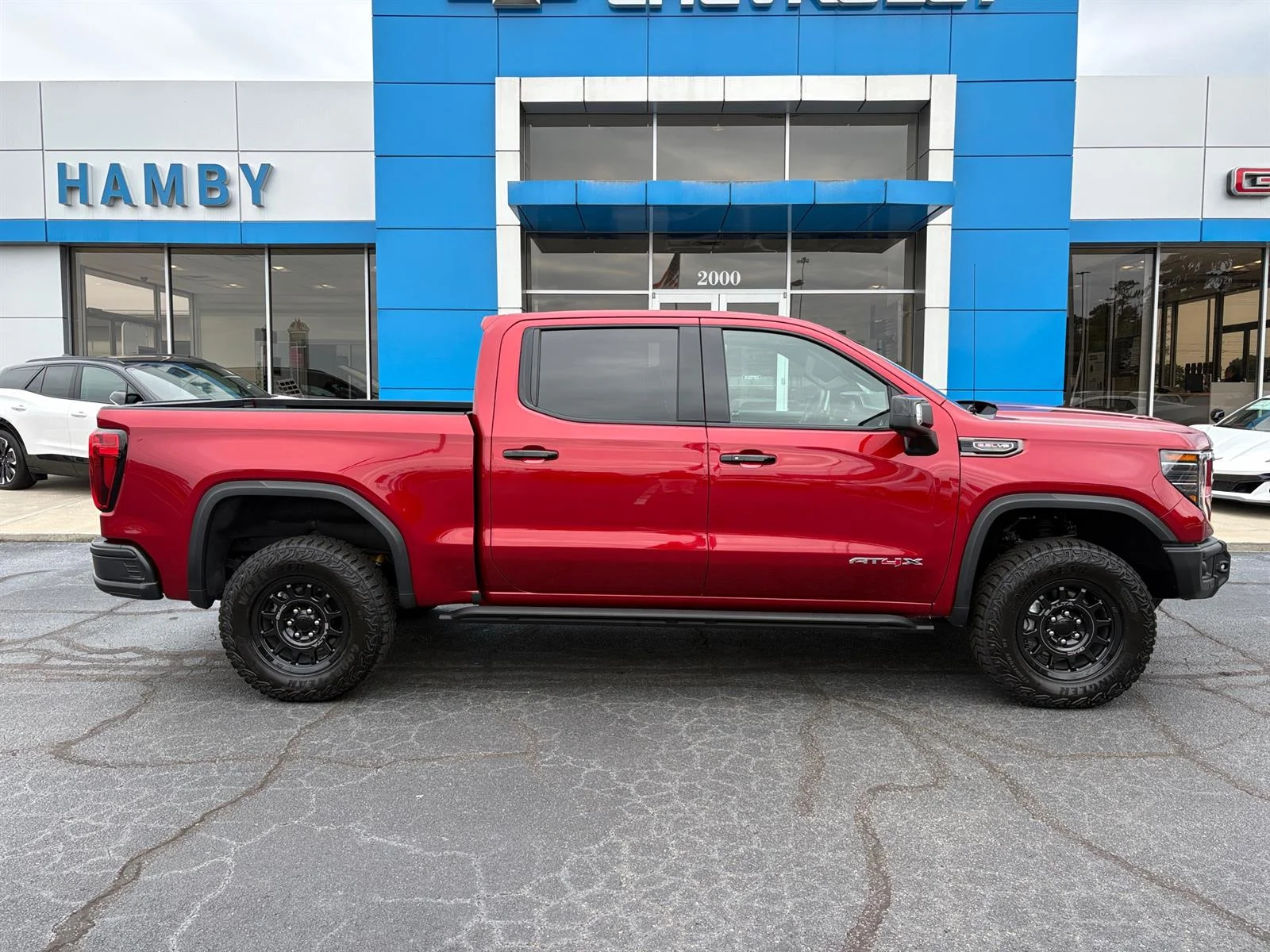 Used 2026 Volcanic Red Tintcoat GMC AT4X image 3