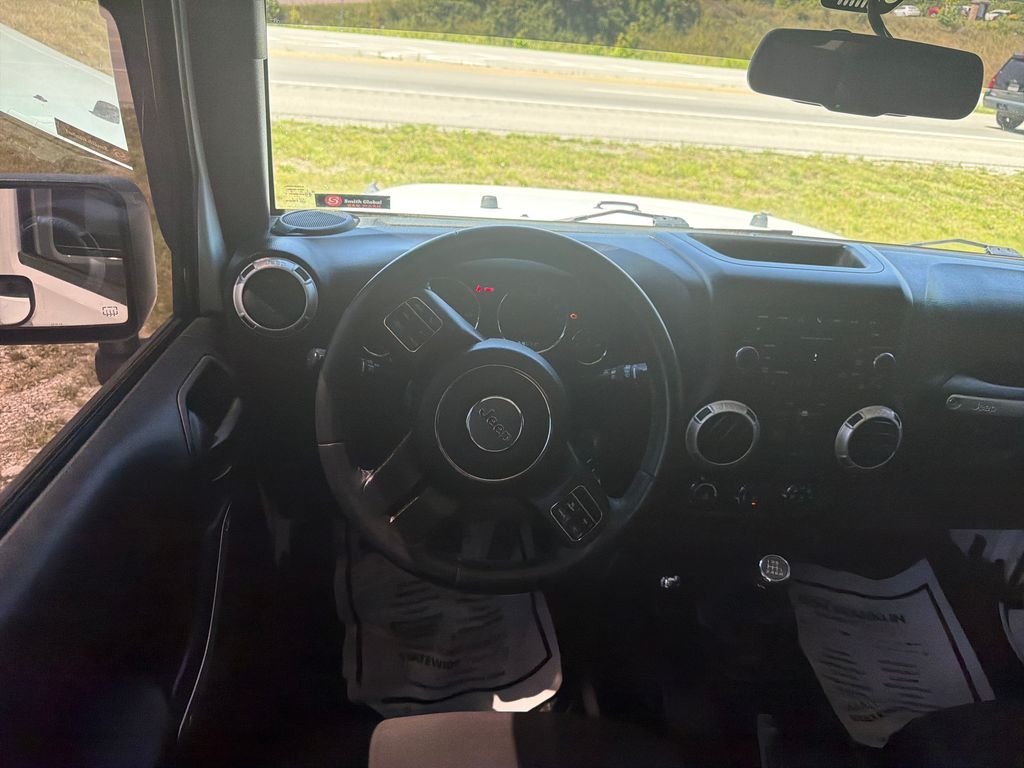 Used 2016 White Jeep Unlimited Sahara image 13