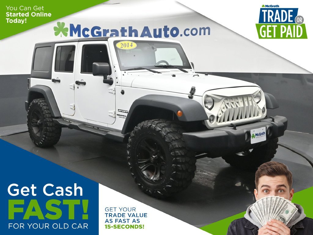 Used 2014 White Jeep Unlimited Sport image 1