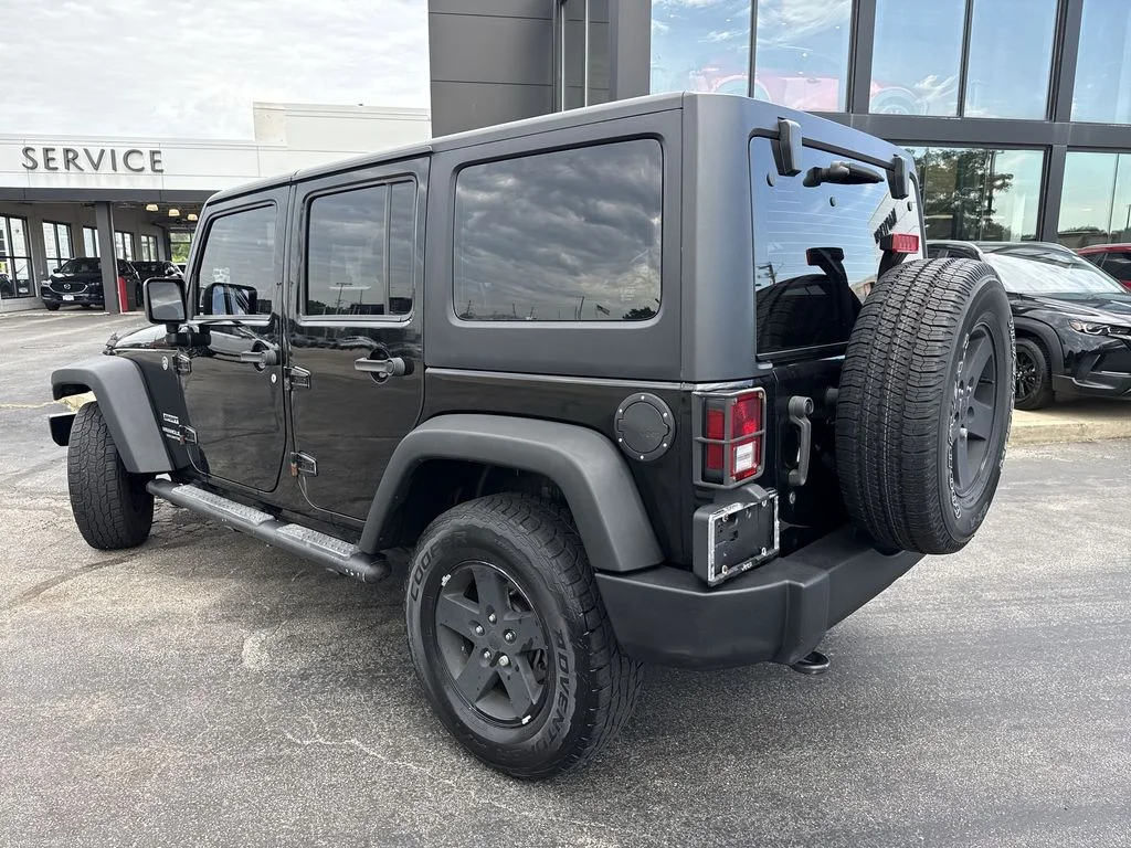 Used 2013 Black Jeep Unlimited Sport image 9