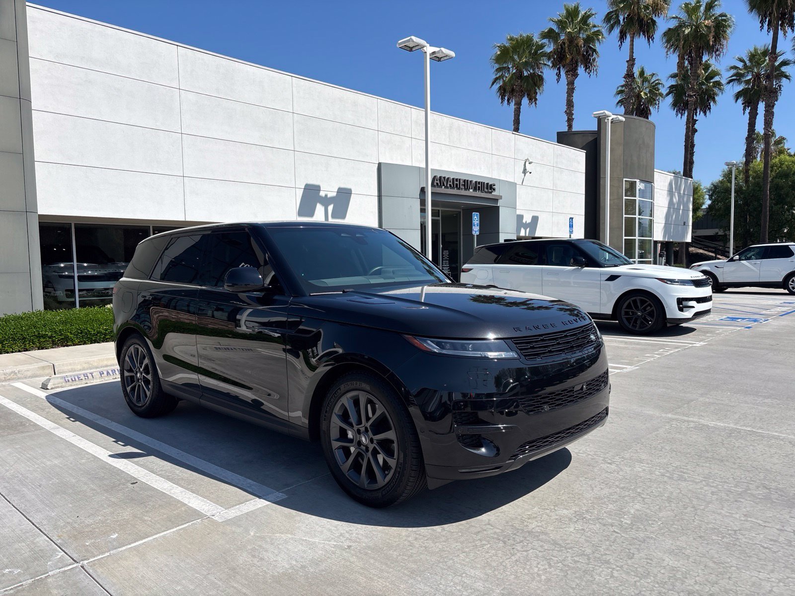 Used 2024 Santorini Black Metallic Land Rover SE image 2