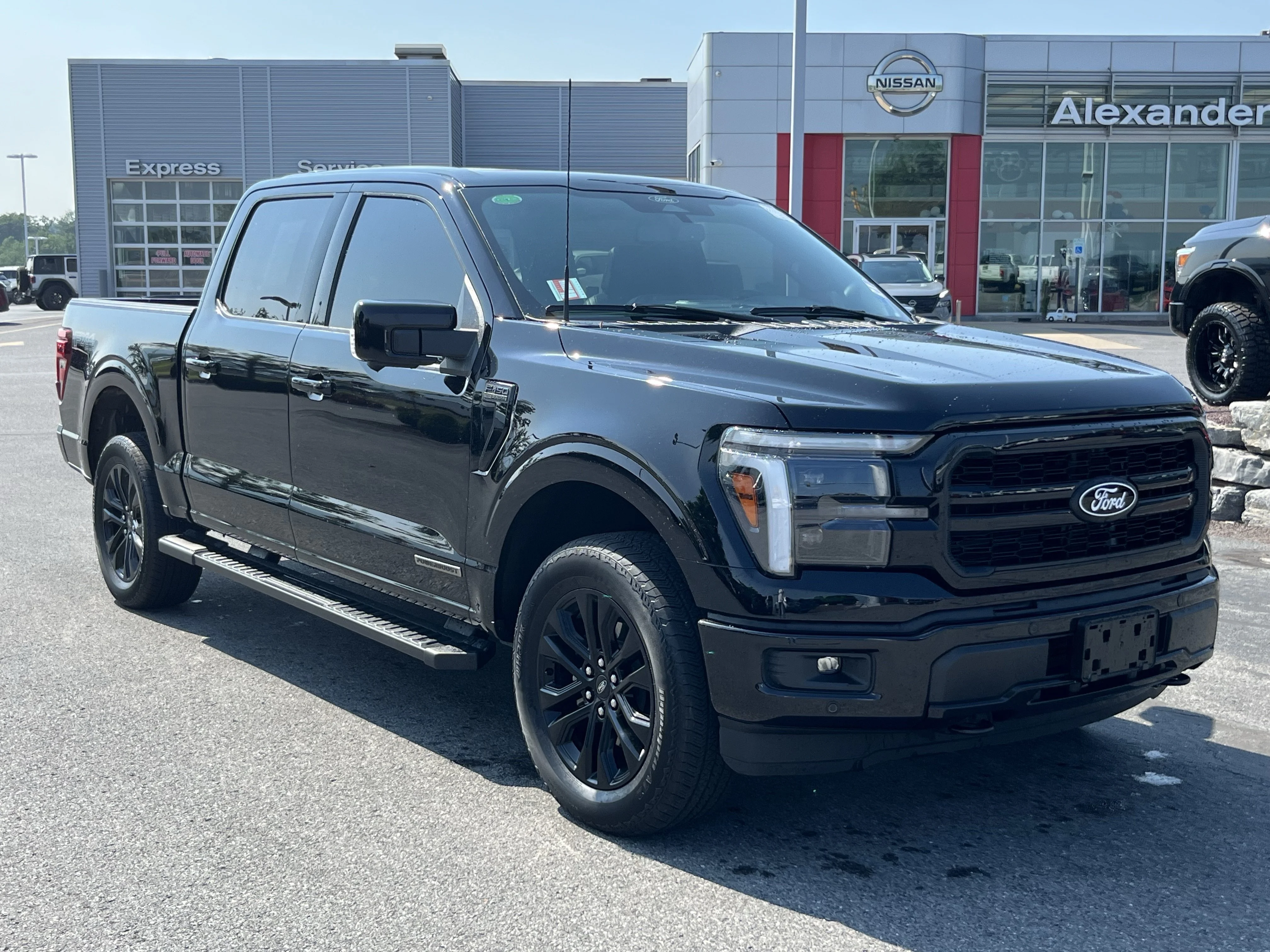 Used 2025 Black Metallic Ford Lariat image 1