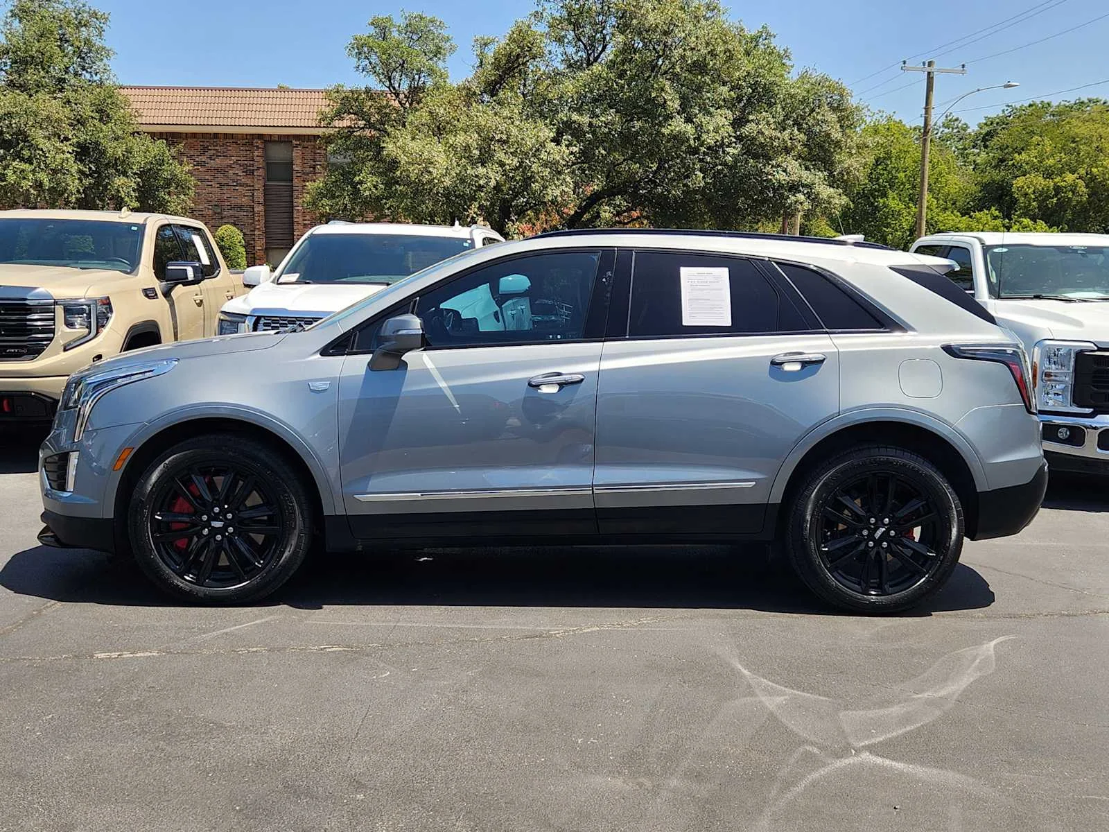 Used 2023 ARGENT SILVER METALLIC Cadillac AWD Sport image 4