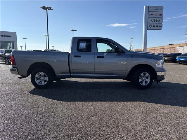 Used 2024 Granite Crystal Metallic Clearcoat RAM SLT 4x4 Quad Cab 6.3 ft. box 140 in. WB image 8