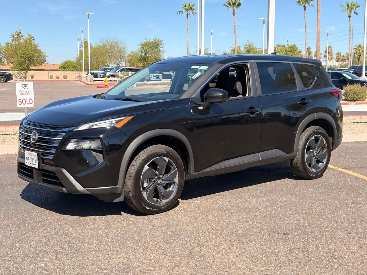 Used 2025 Super Black Nissan SV image 1