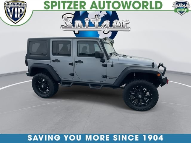 Used 2015 Silver Jeep Unlimited Sport image 10