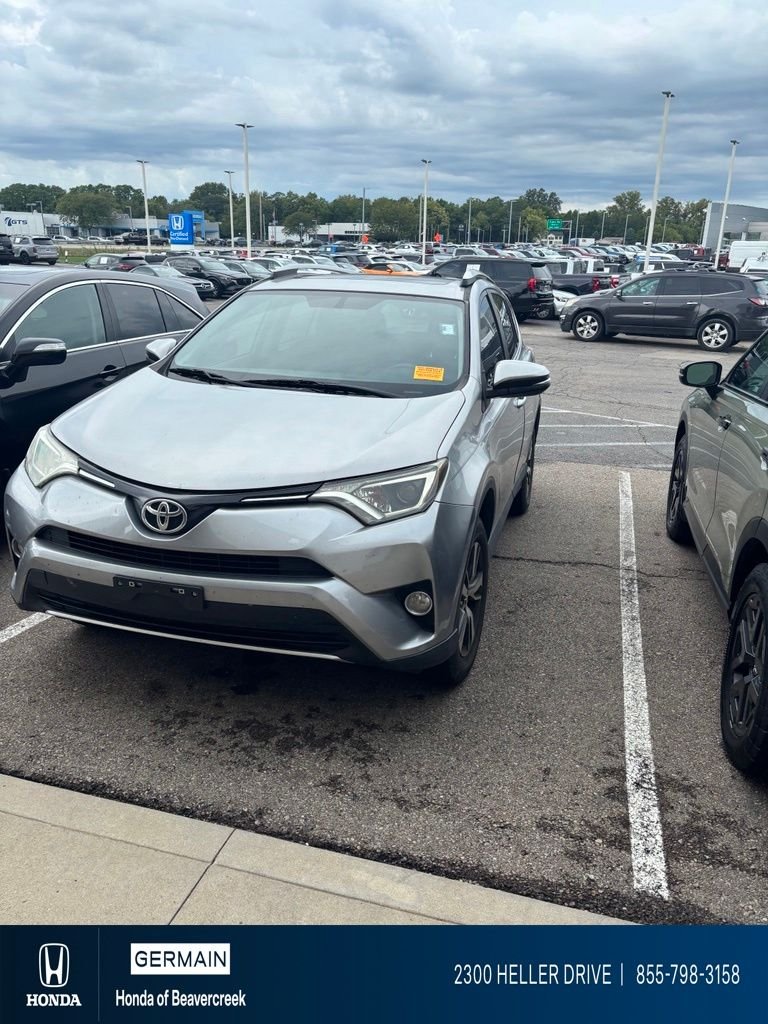 Used 2016 Silver Sky Metallic Toyota XLE image 1