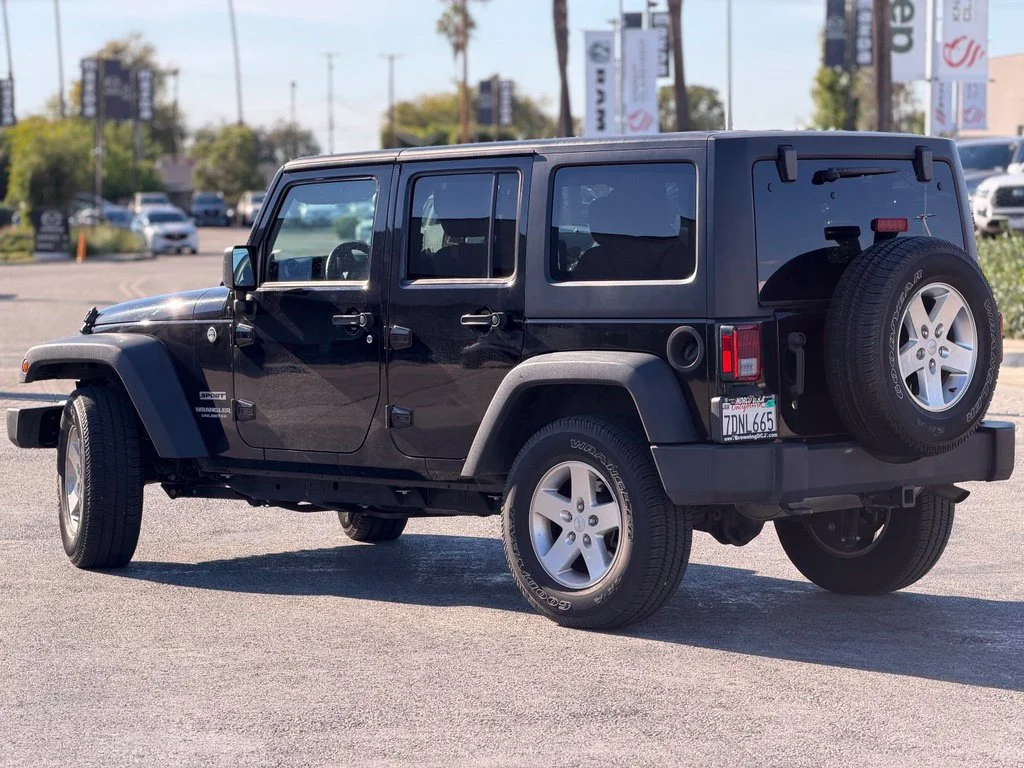 Used 2014 Black Jeep Unlimited Sport image 3