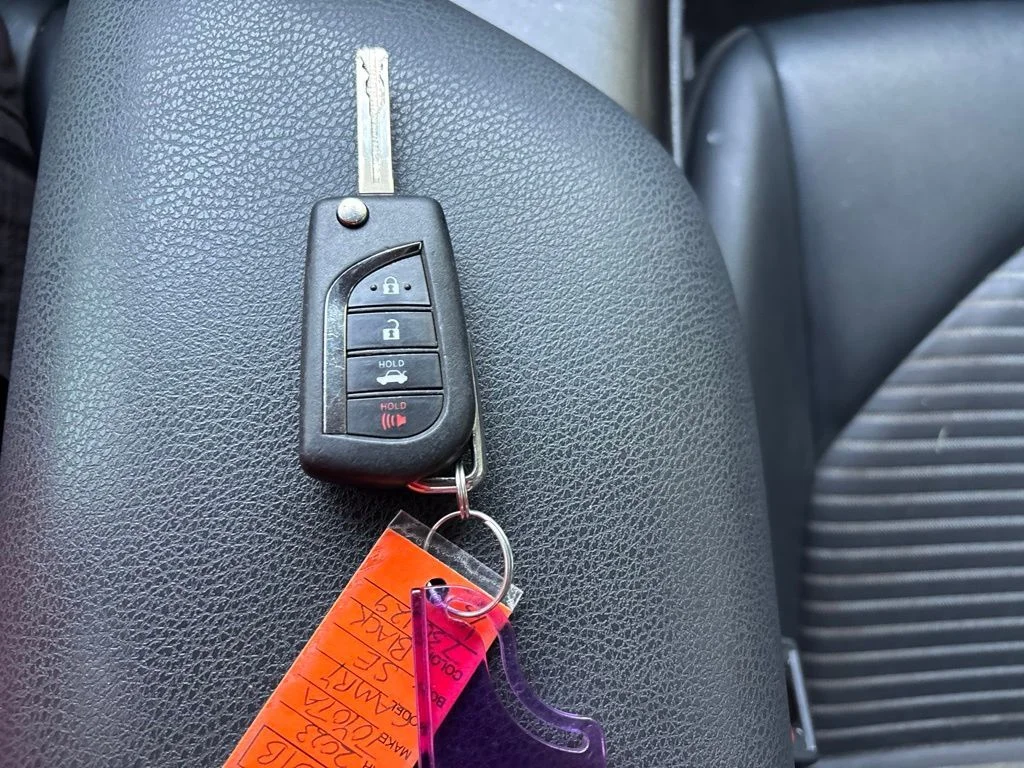 Used 2023 Midnight Black Metallic Toyota SE image 19