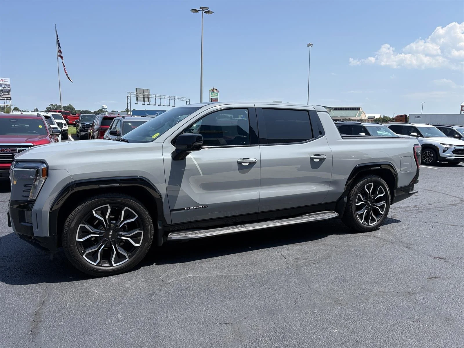 Used 2025 Thunderstorm Gray GMC Max Range Denali image 12