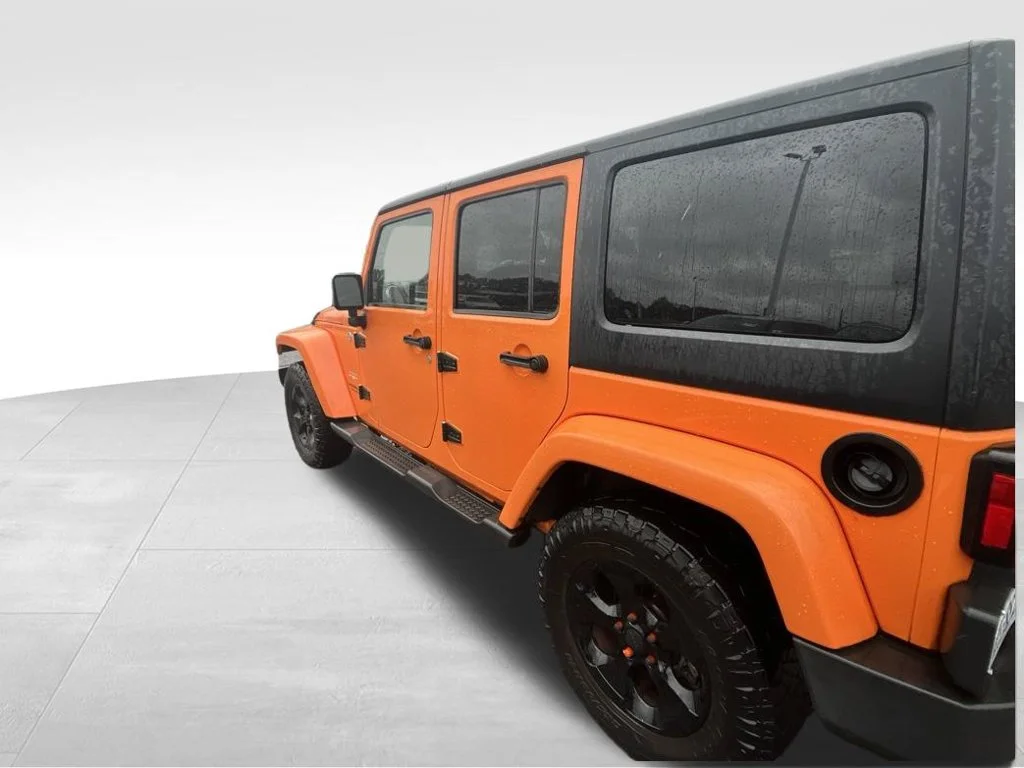 Used 2013 Orange Jeep Unlimited Sahara image 11