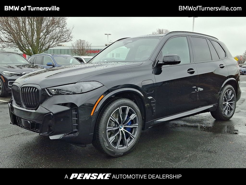 Used 2026 Black Sapphire Metallic BMW xDrive50e image 1
