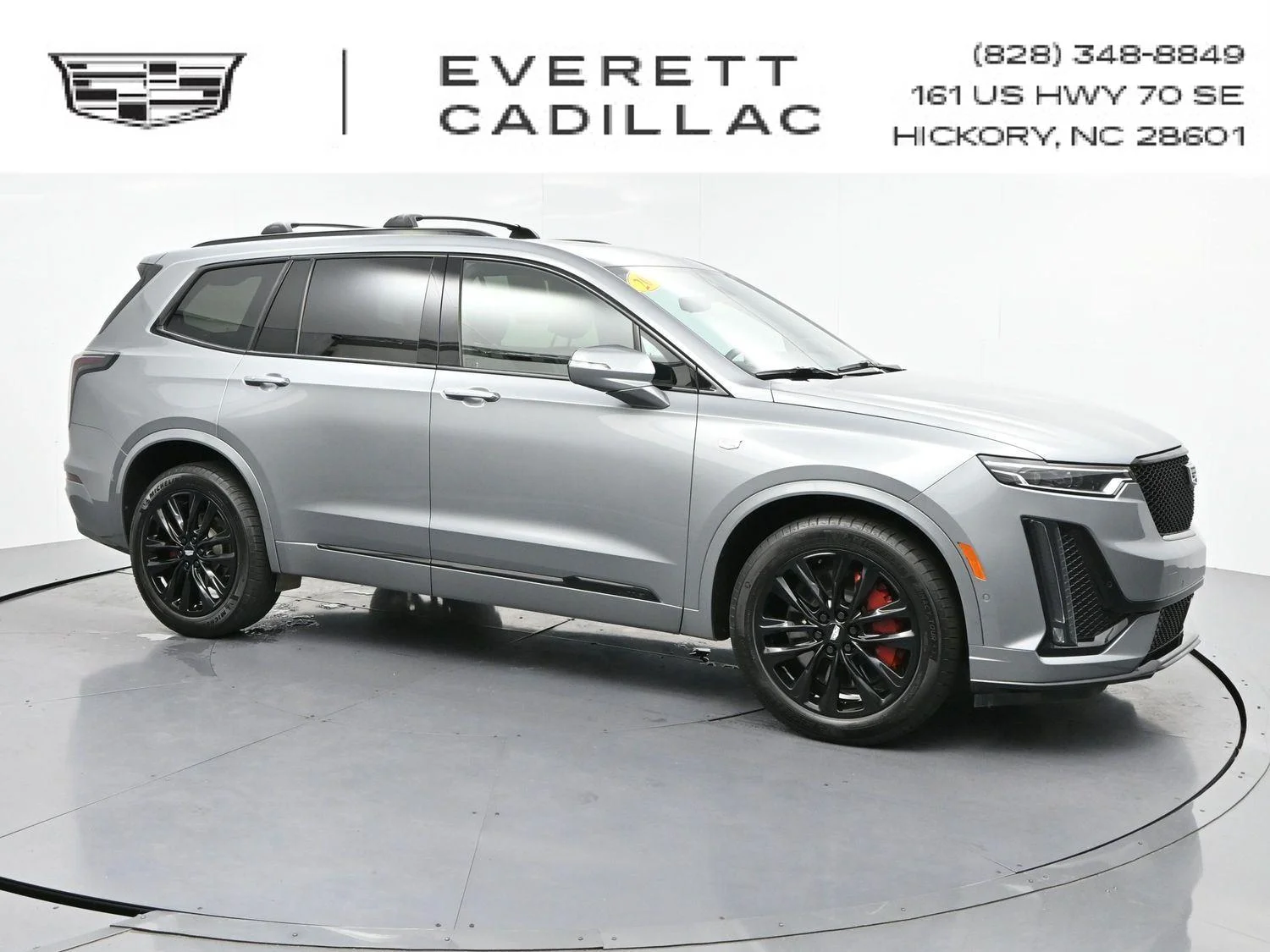 Used 2024 Argent Silver Metallic Cadillac Sport image 1