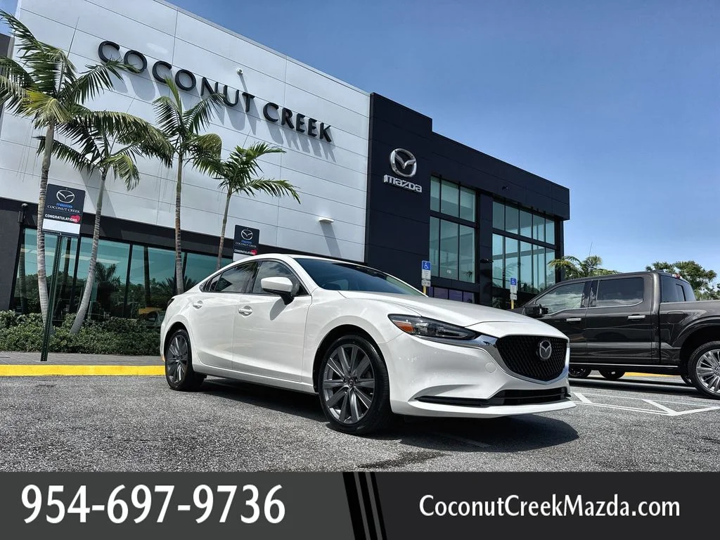 Used 2020 Snowflake White Pearl Mica Mazda Touring image 1