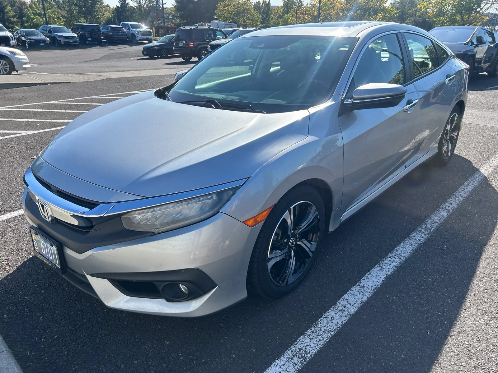 Used 2016 Lunar Silver Metallic Honda Touring image 1