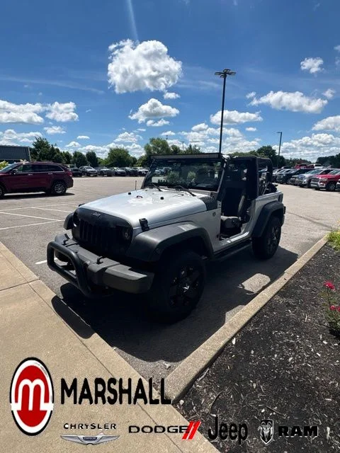 Used 2010 Silver Jeep Sport image 1