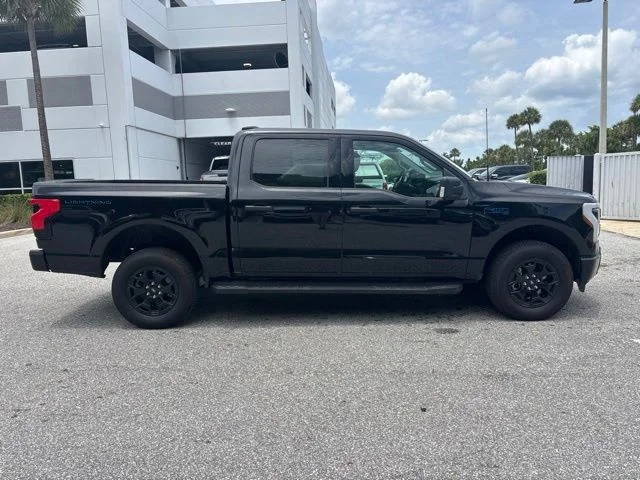 Used 2025 Ford F-150 Lightning XLT with VIN 1FTVW3LK5SWG14299 for sale in Delray Beach, FL