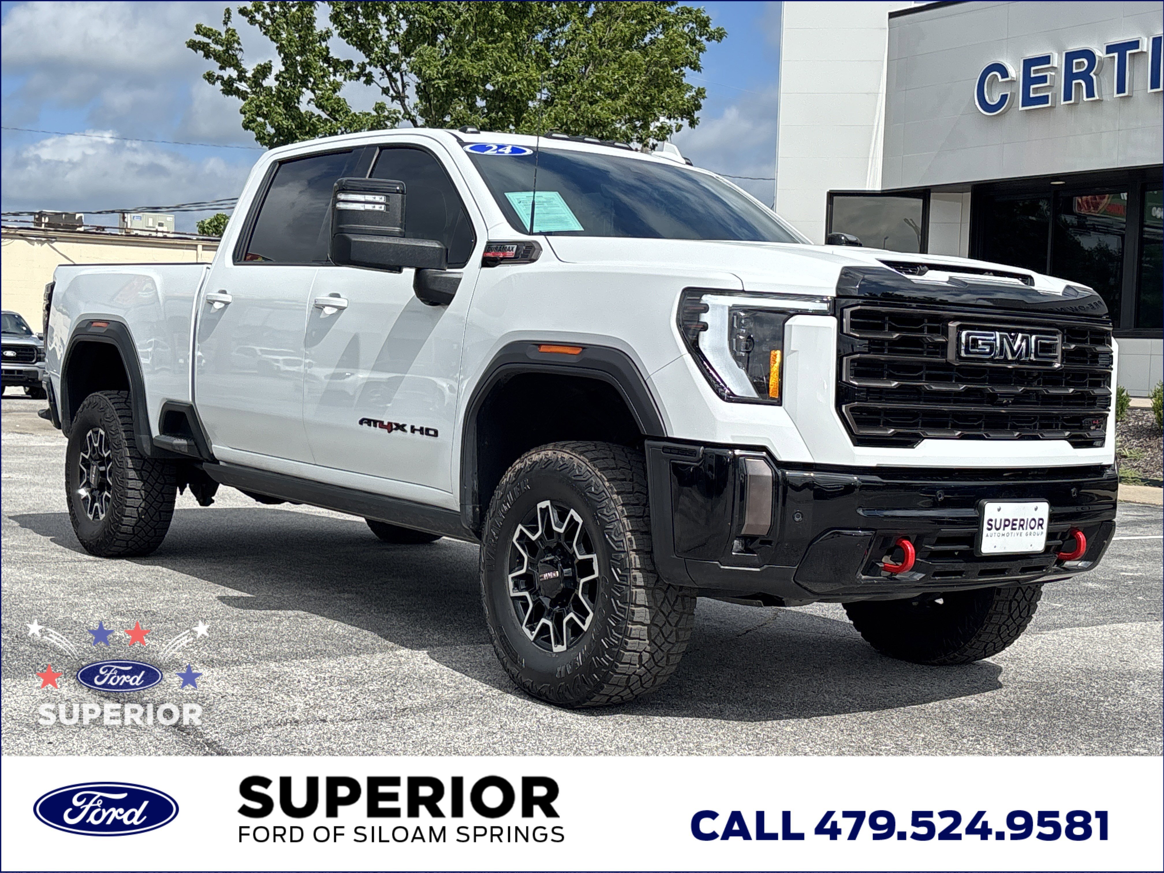 Used 2024 Summit White GMC AT4X Crew Cab 4WD image 1