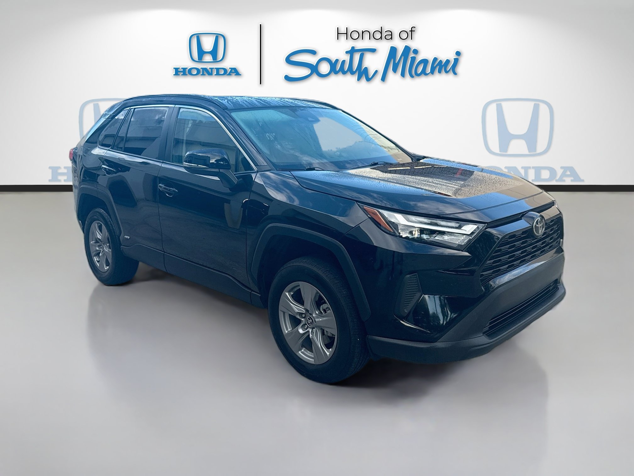 Used 2025 Midnight Black Metallic Toyota Hybrid LE image 1
